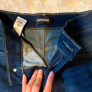 High rise express dark denim jeans . Mint condition .